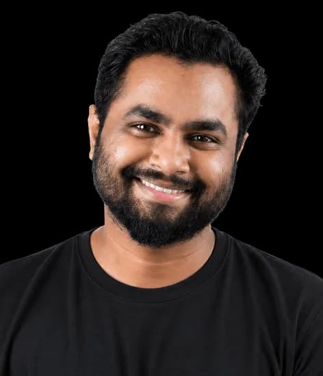 Portrait of a Red Baton team member smiling in a black T-shirt
