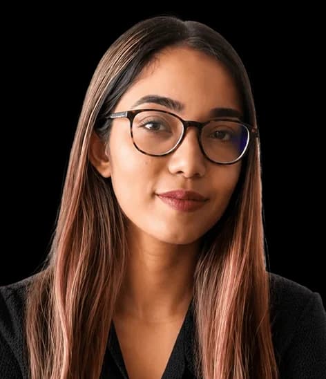 Portrait of a Red Baton team member wearing glasses and a black top